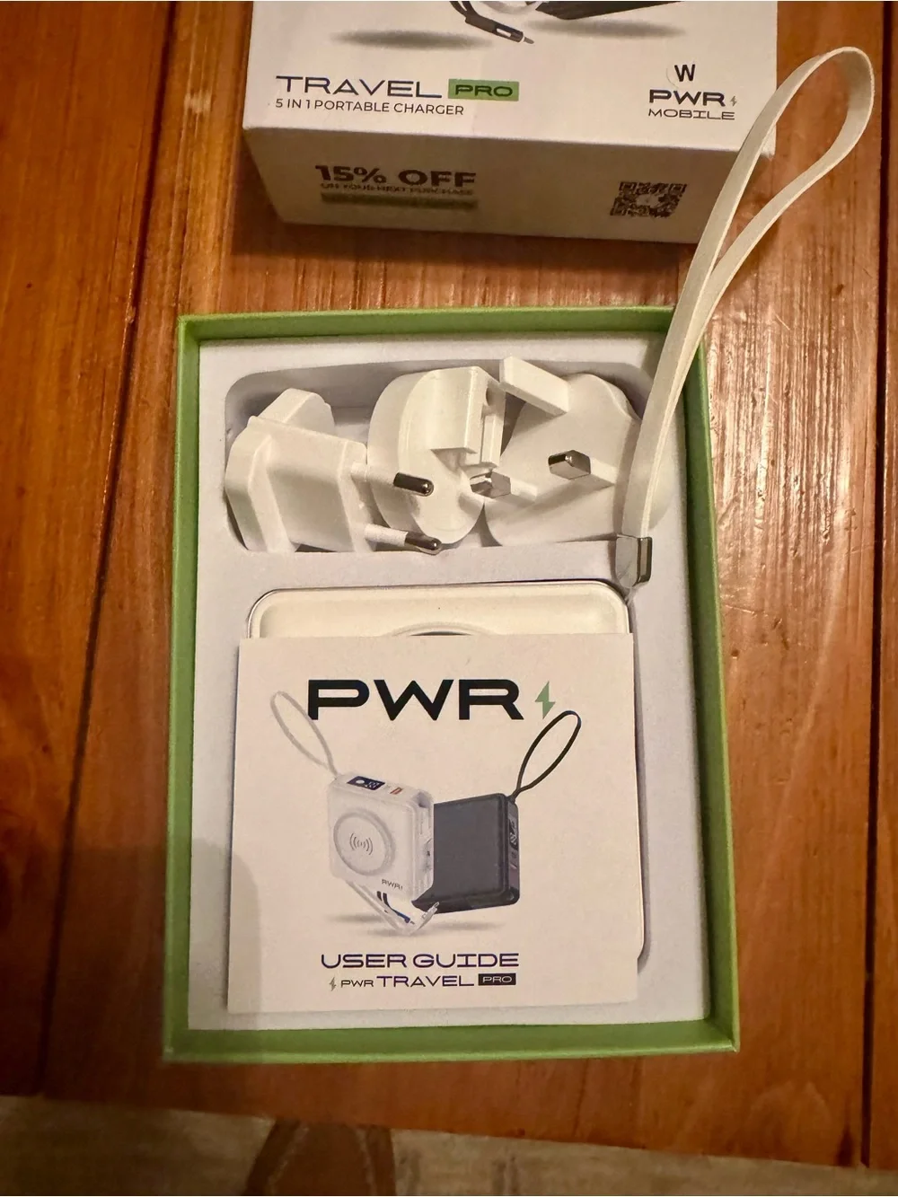 Portable White Travel Charger with Wireless Pad and Plug Adapters